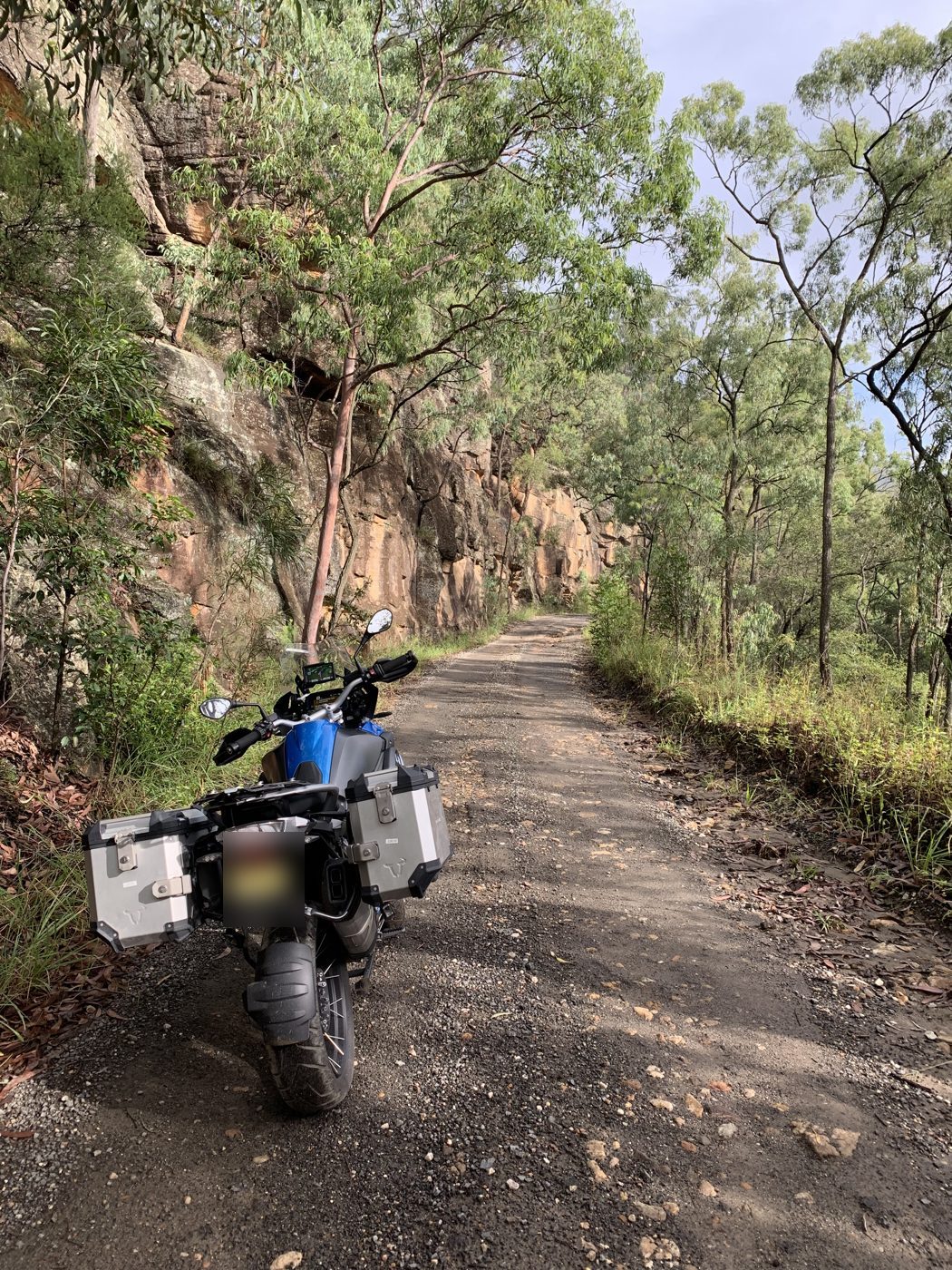 Under the sandstone cliffs