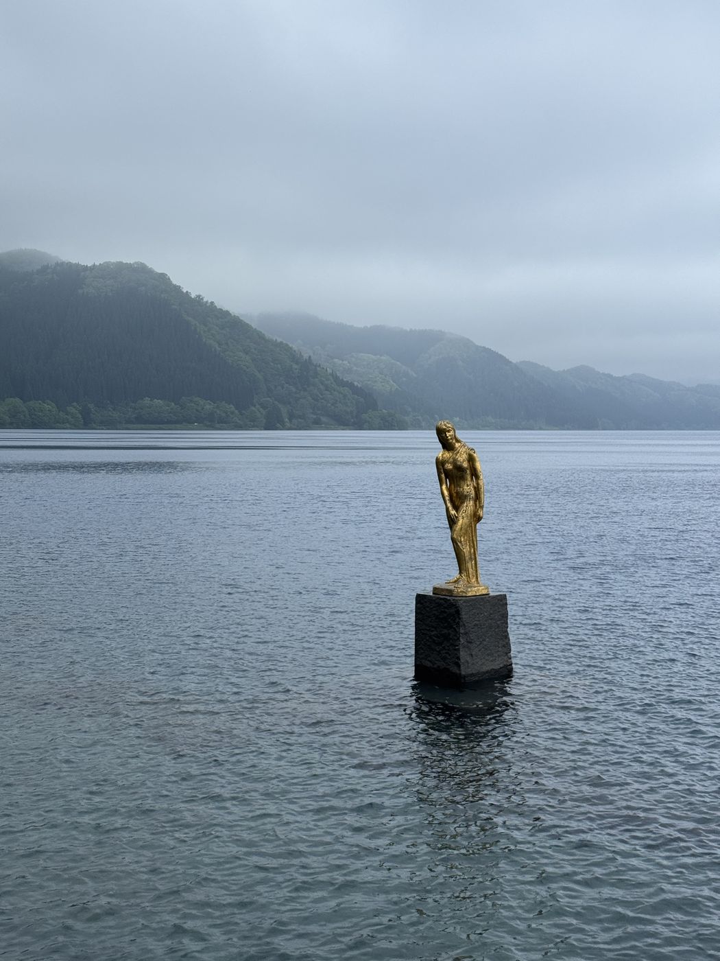 The golden Tatsuko statue on Lake Tazawa
