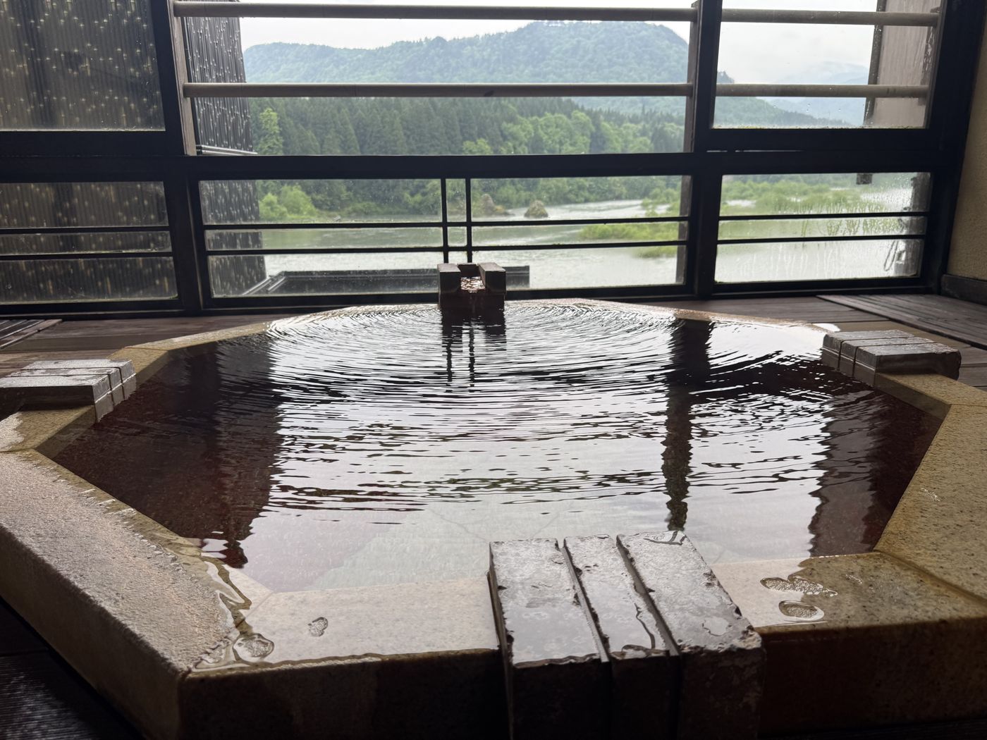 The hot-spring bath overlooking the river
