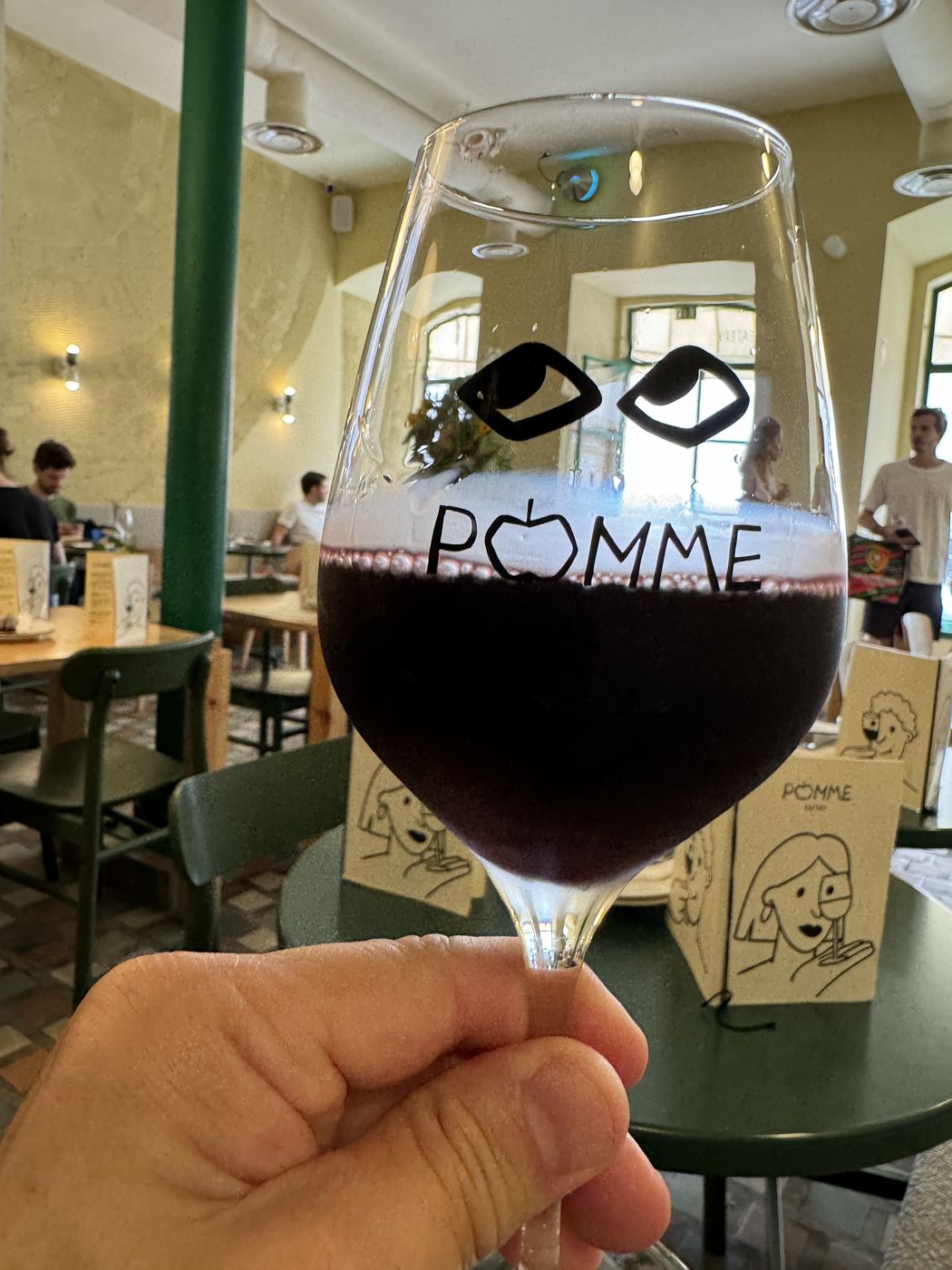 A glass of red at Pomme
